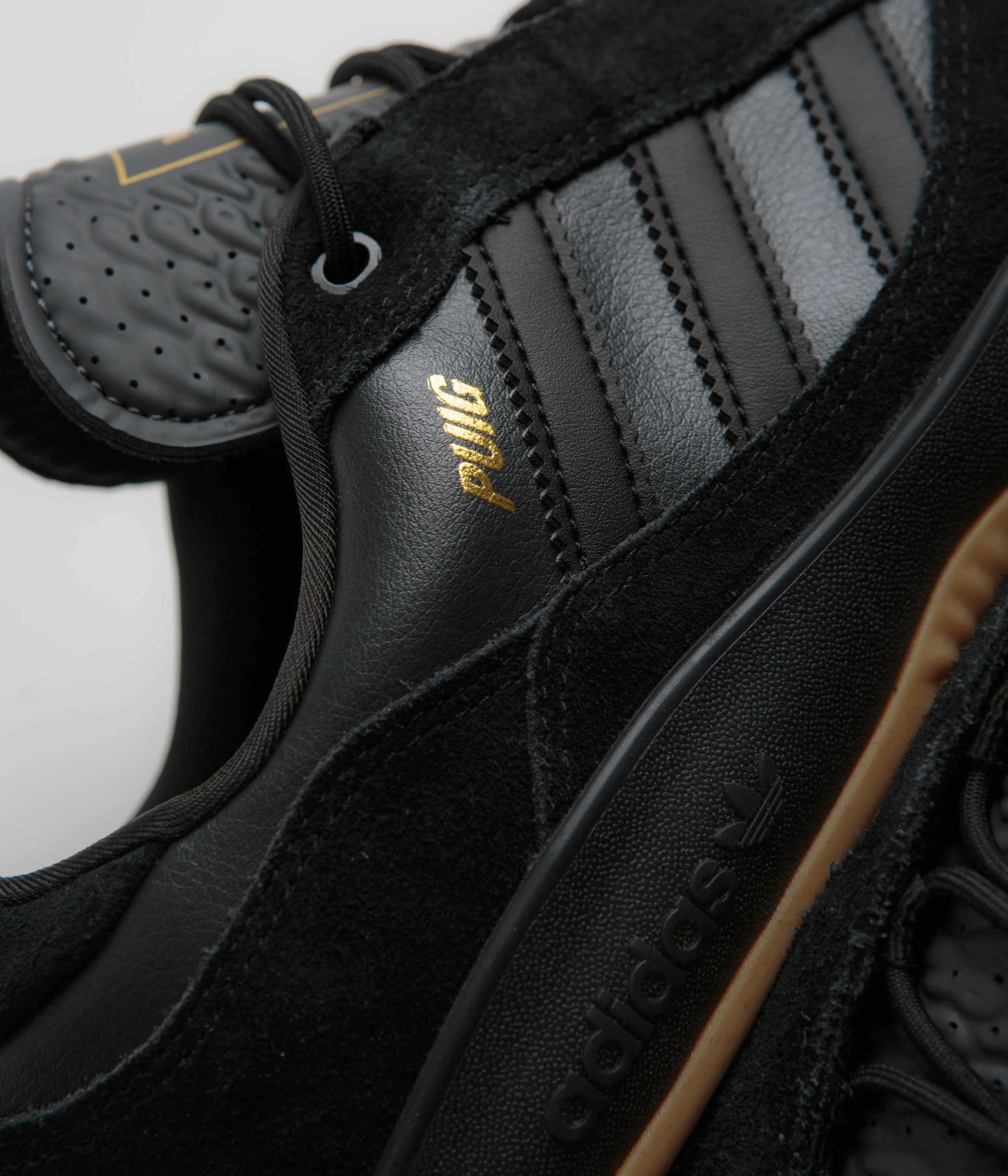 Adidas Puig Shoes - Core Black / Carbon / Gold Metallic